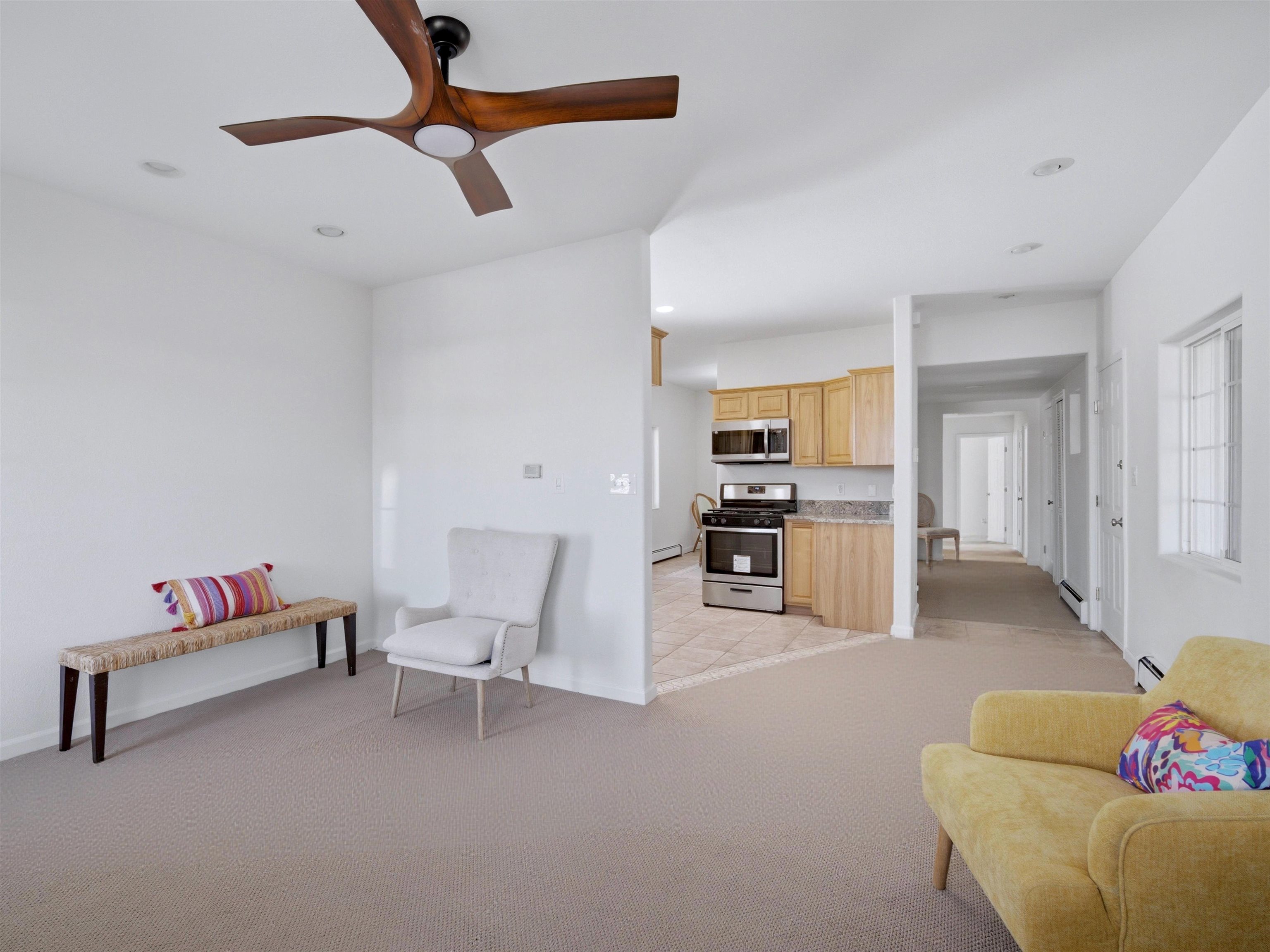 252 South Peach Street Fruita, CO 81521 - Photo 6 of 22 a living room with furniture and kitchen view