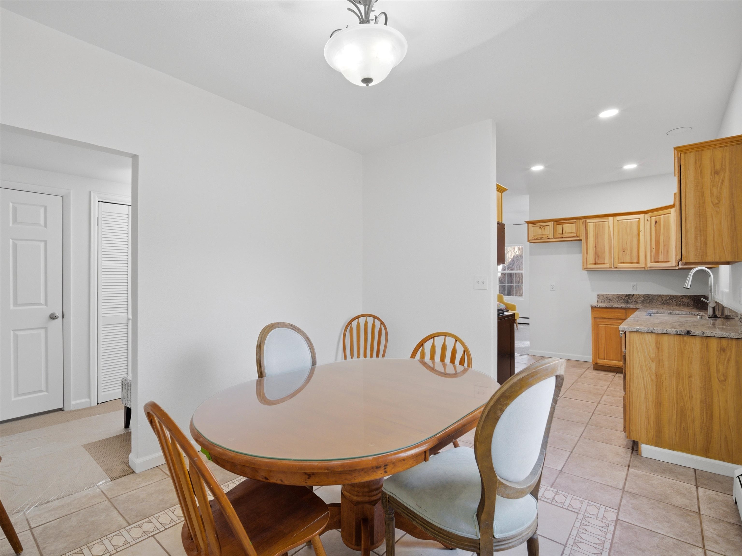 252 South Peach Street Fruita, CO 81521 - Photo 10 of 22 a dining room with furniture and a chandelier