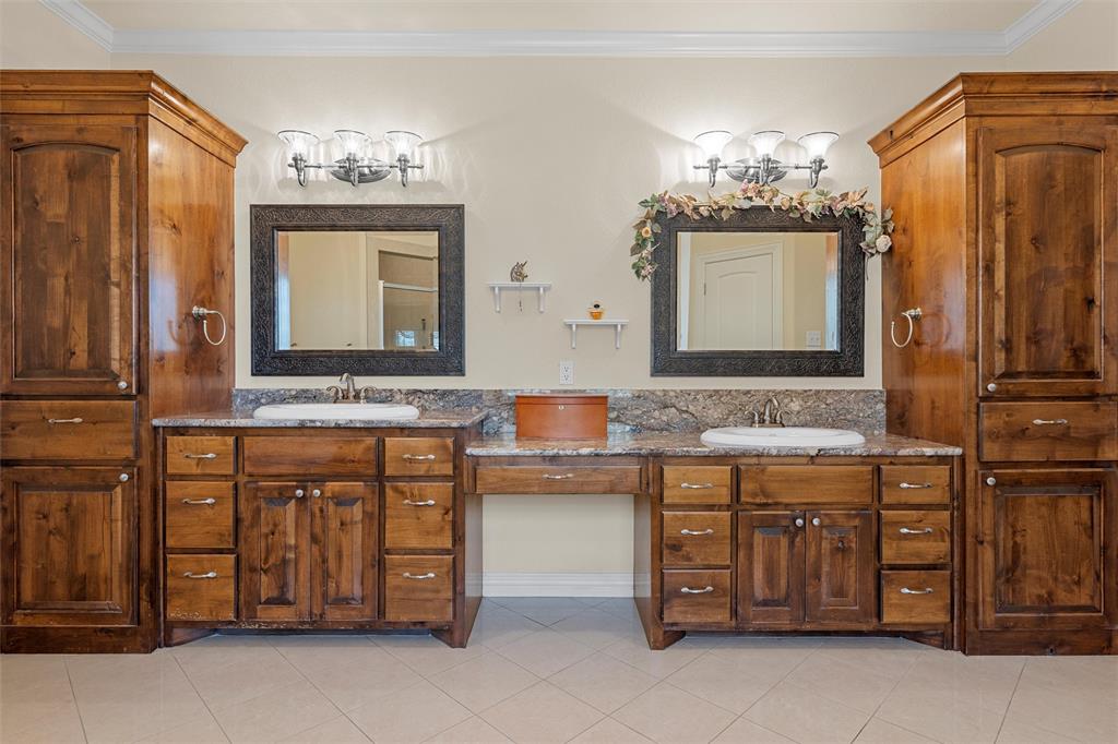 1125 Whispering Oaks China Spring, TX 76633 - Photo 14 of 39 Full bath with crown molding, light tile patterned floors, and double vanity