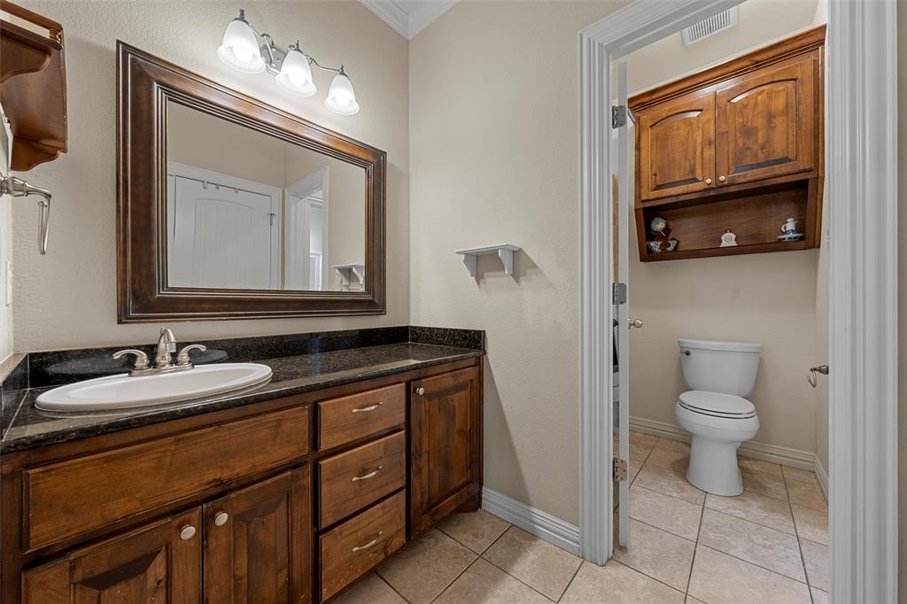 1125 Whispering Oaks China Spring, TX 76633 - Photo 22 of 39 Bathroom featuring vanity, light tile patterned floors, and ornamental molding