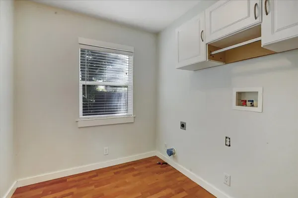 an empty room with closet area