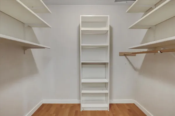 a view of a livingroom with a ceiling fan window and a ceiling fan