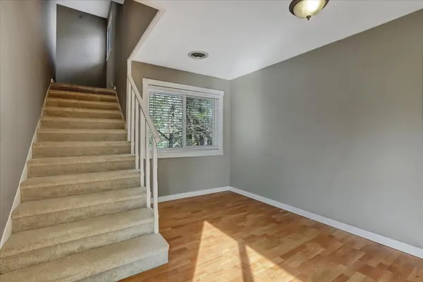 a bathroom with a sink toilet vanity and shower