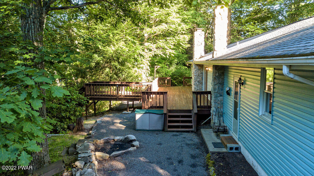 166 Devils Hole Road Cresco, PA 18326 - Photo 36 of 46 a view of backyard with a table and chairs and potted plants