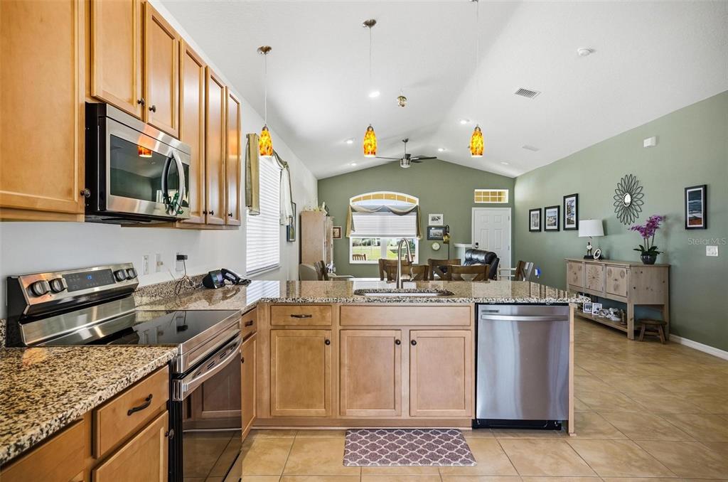 2 Tideway Trail Palm Coast, FL 32137 - Photo 12 of 34 a kitchen with a sink stove and cabinets
