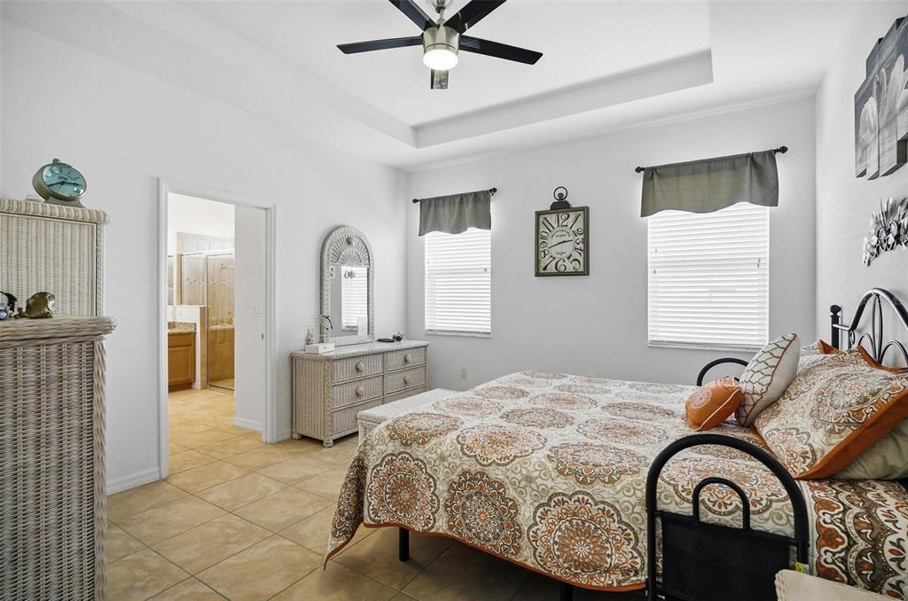 2 Tideway Trail Palm Coast, FL 32137 - Photo 15 of 34 a bedroom with a bed and dresser with mirror