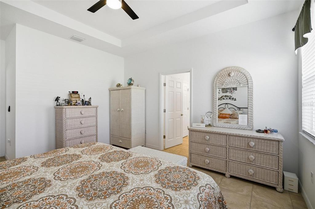 2 Tideway Trail Palm Coast, FL 32137 - Photo 17 of 34 a bedroom with a bed and a dresser