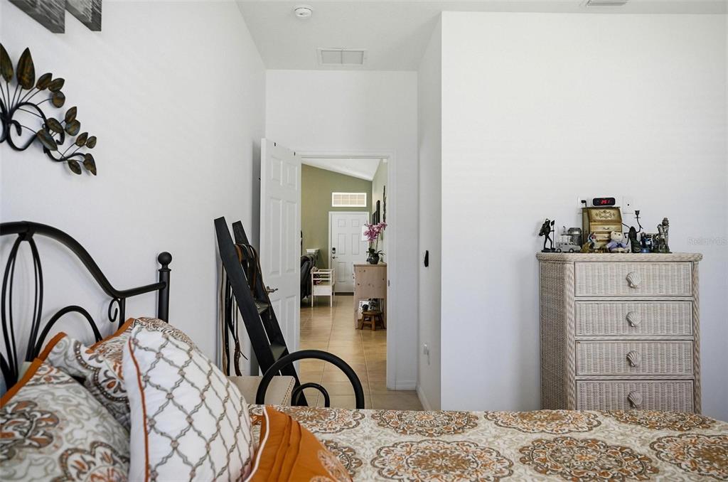 2 Tideway Trail Palm Coast, FL 32137 - Photo 21 of 34 a bedroom with a bed and a dresser in it