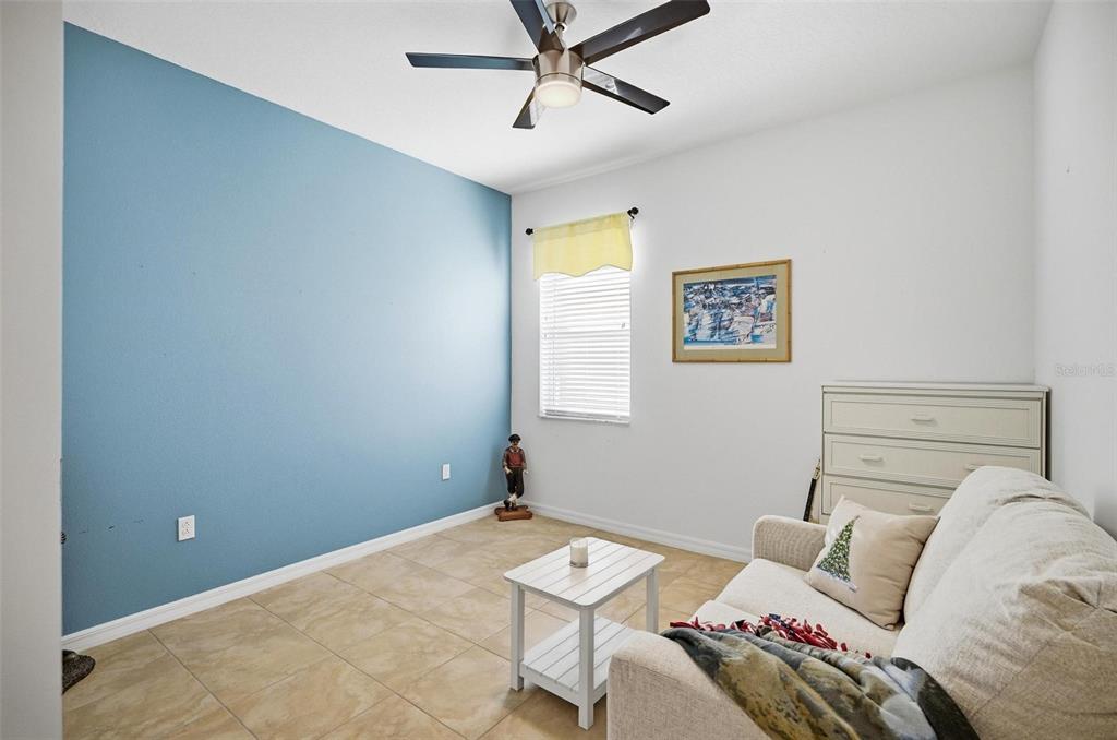 2 Tideway Trail Palm Coast, FL 32137 - Photo 23 of 34 a bedroom with a bed and a chandelier