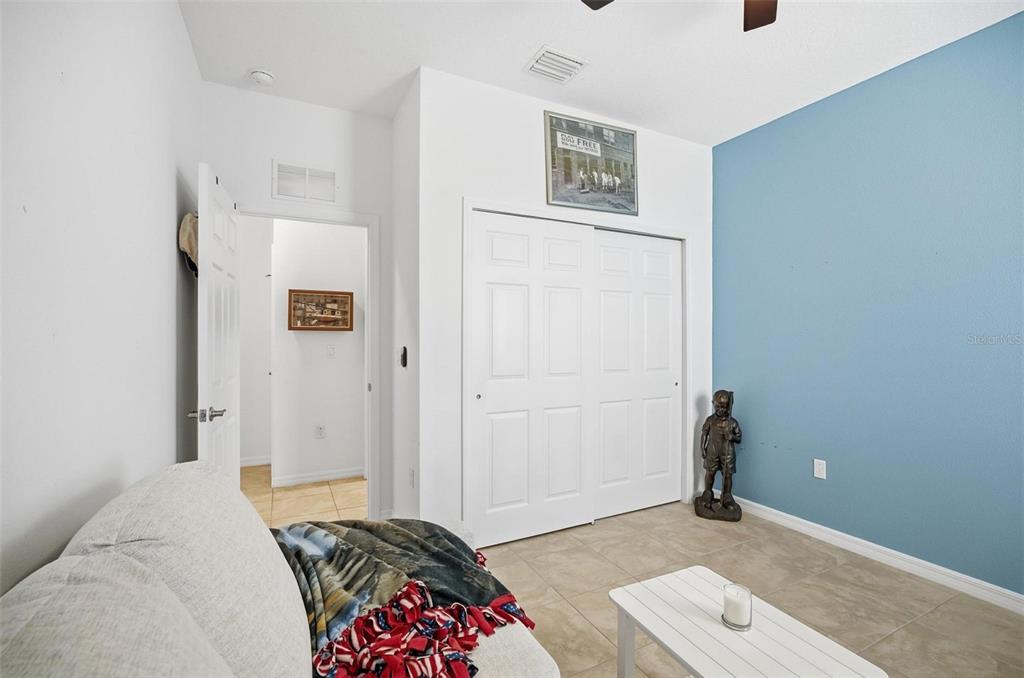 2 Tideway Trail Palm Coast, FL 32137 - Photo 24 of 34 a bedroom with a bed and a cabinets