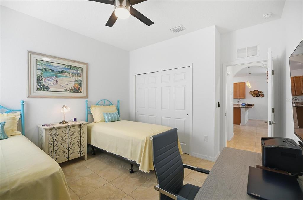 2 Tideway Trail Palm Coast, FL 32137 - Photo 26 of 34 a bedroom with a bed and a chandelier