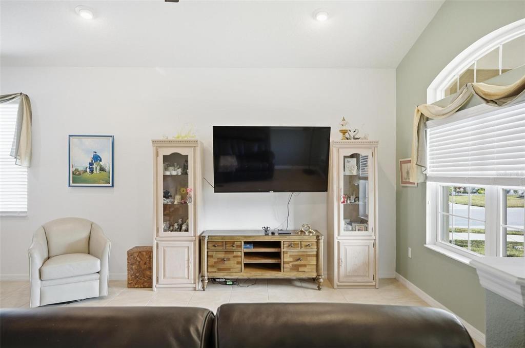 2 Tideway Trail Palm Coast, FL 32137 - Photo 27 of 34 a living room with furniture and a flat screen tv
