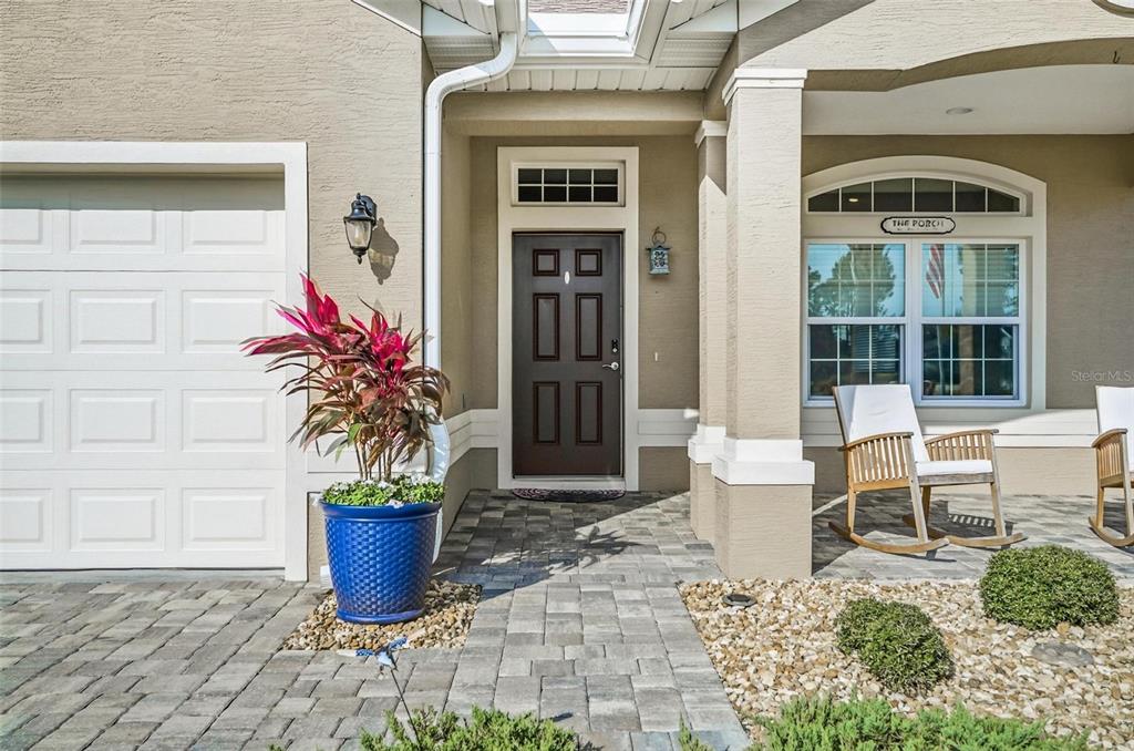 2 Tideway Trail Palm Coast, FL 32137 - Photo 4 of 34 a view of a porch with a potted plant