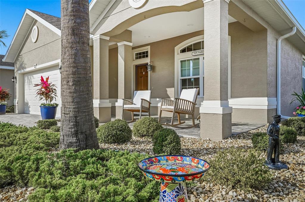 2 Tideway Trail Palm Coast, FL 32137 - Photo 5 of 34 a backyard of a house with table and chairs