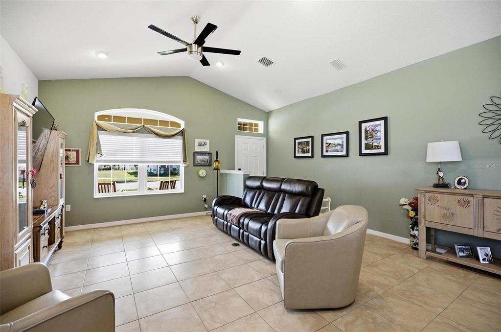 2 Tideway Trail Palm Coast, FL 32137 - Photo 6 of 34 a living room with furniture and a flat screen tv