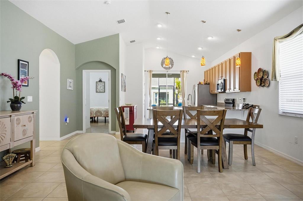 2 Tideway Trail Palm Coast, FL 32137 - Photo 10 of 34 a living room with furniture a flat screen tv and a window