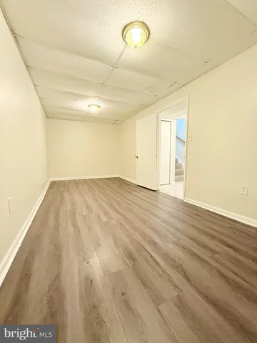 a bathroom with a toilet a sink and a mirror