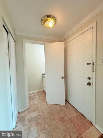 a white toilet sitting next to a shower