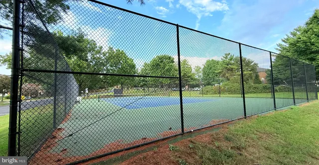 a view of a house with a yard and a garage