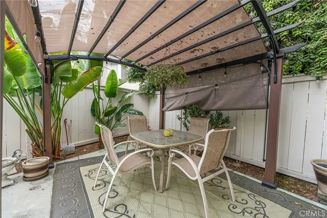 a view of an outdoor space with a table and chair