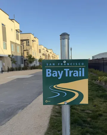 a sign board on the side of a road