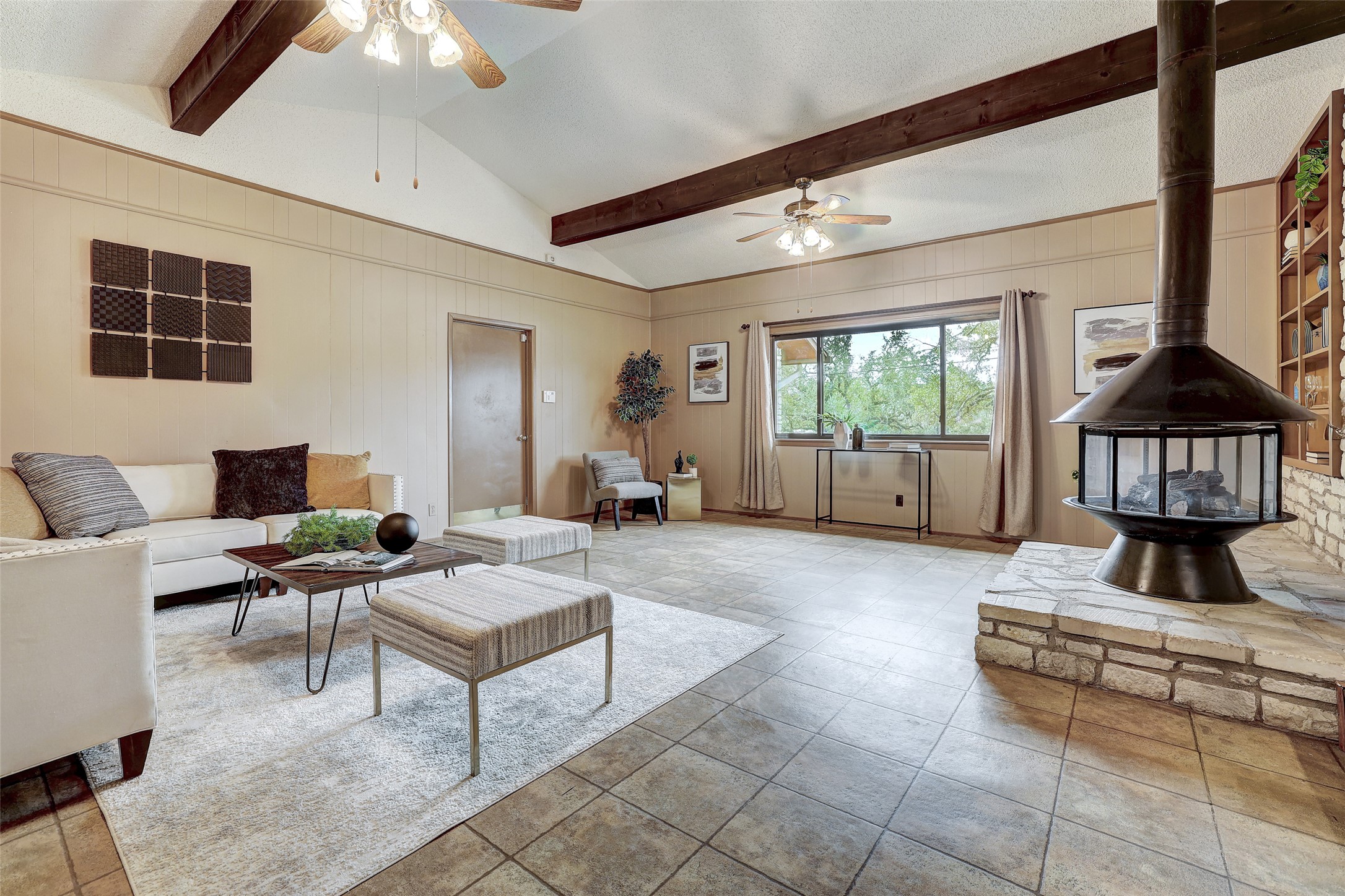 8606 Thunderbird Road, Unit A & B Austin, TX 78736 - Photo 14 of 29 Living area featuring a fireplace , ceiling fan, and windows facing front yard