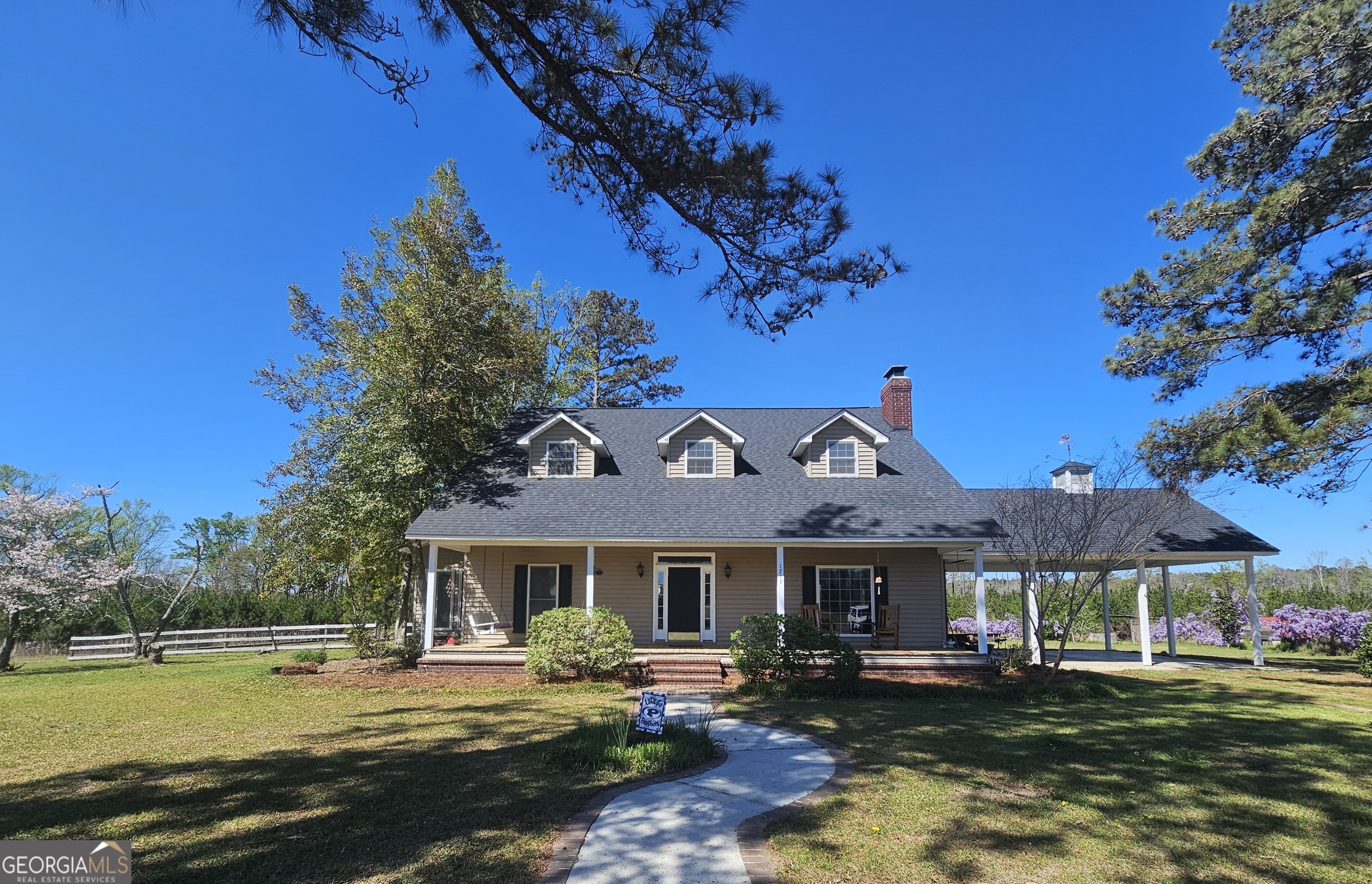 1717 Grady Saunders Road Portal, GA 30450 - Photo 1 of 41 a front view of a house with garden
