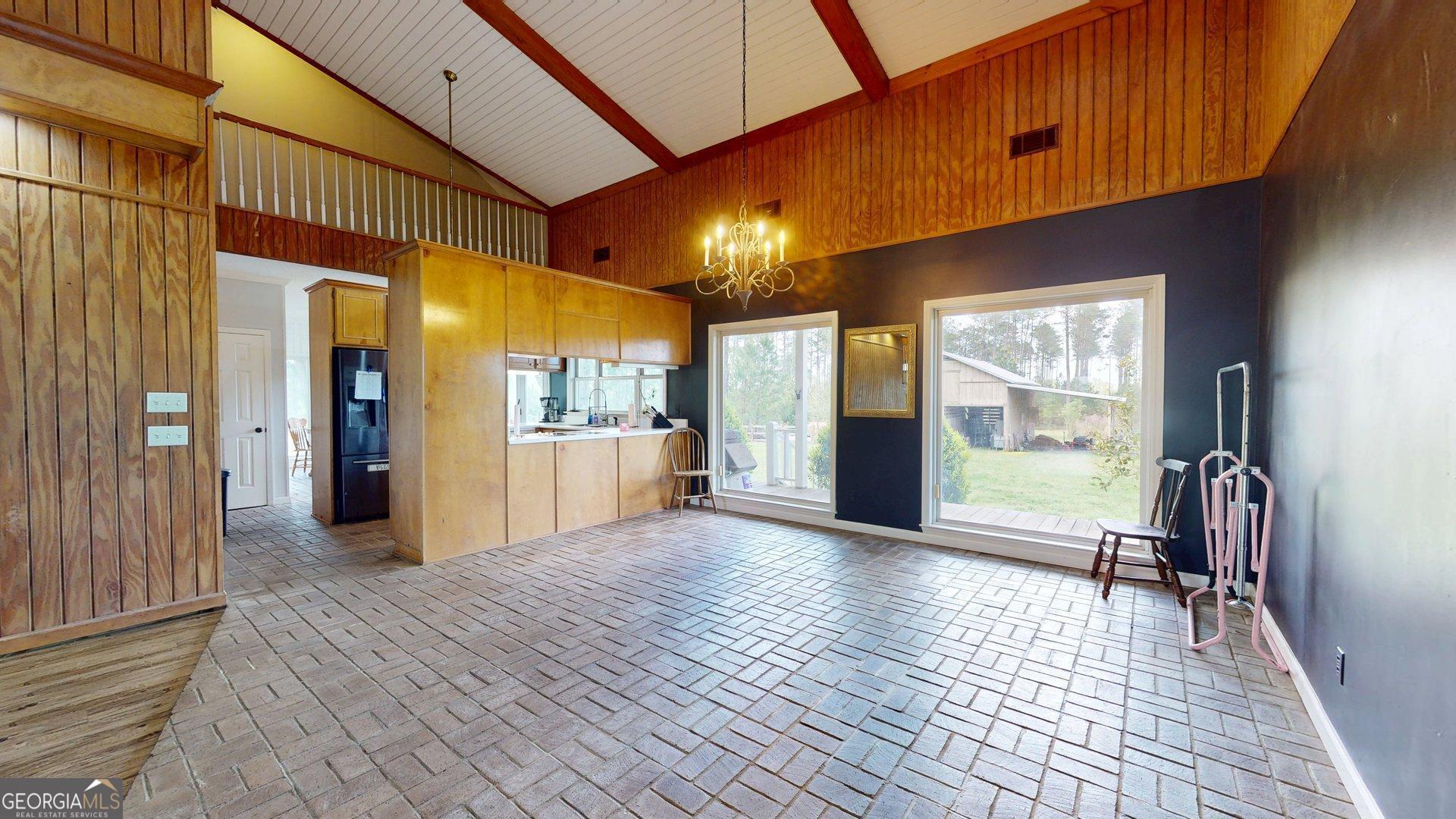1717 Grady Saunders Road Portal, GA 30450 - Photo 12 of 41 a view of a livingroom with furniture and floor to ceiling window