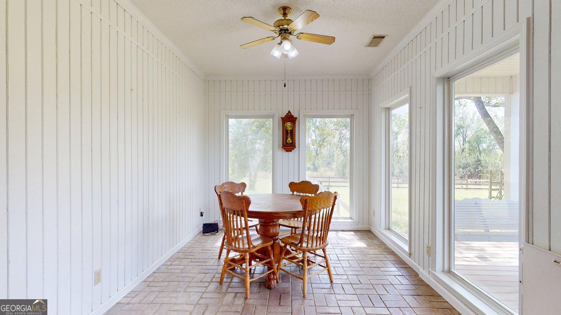 1717 Grady Saunders Road Portal, GA 30450 - Photo 17 of 41 a dining room with furniture and window