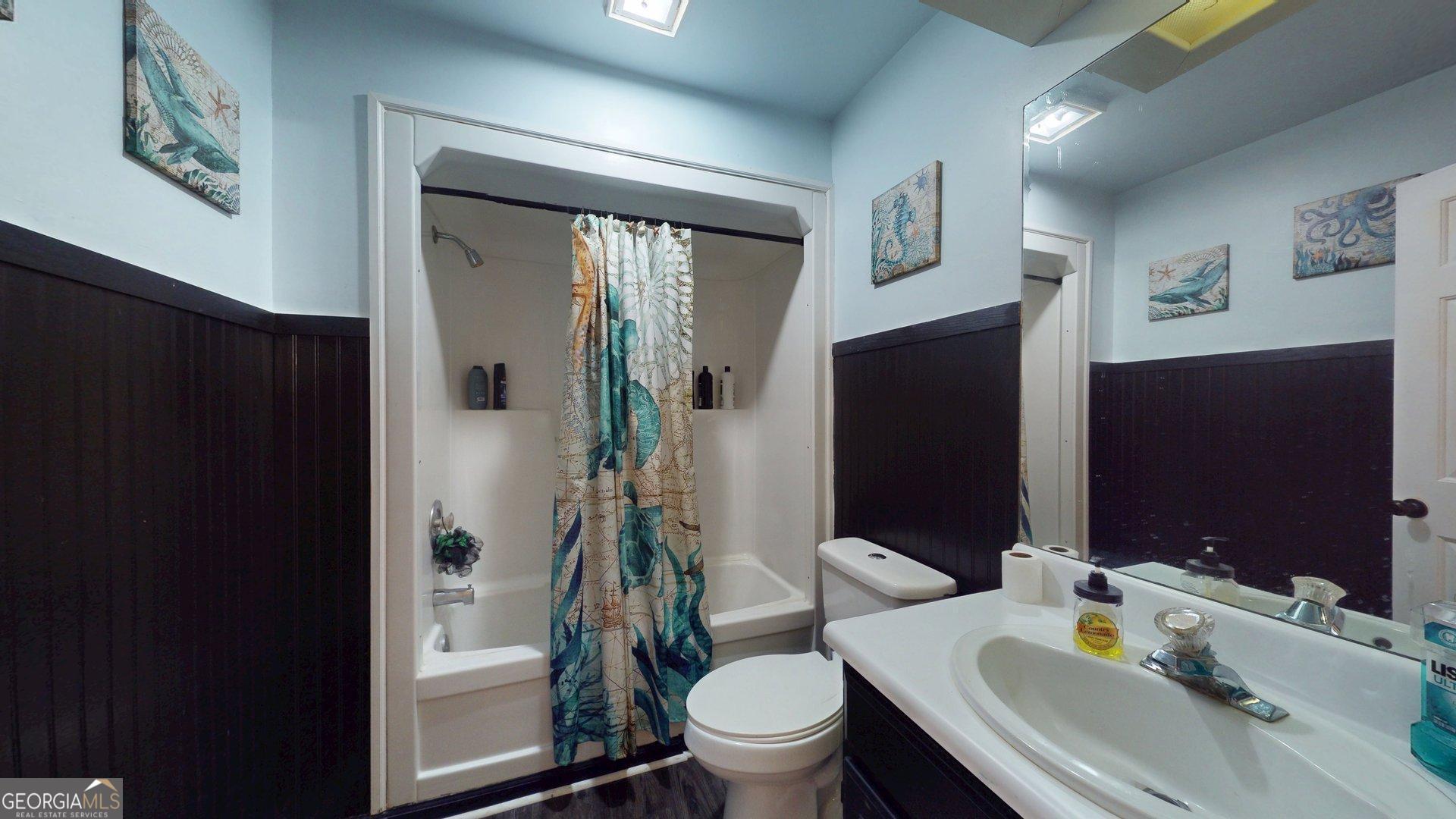 1717 Grady Saunders Road Portal, GA 30450 - Photo 35 of 41 a bathroom with a sink toilet and shower