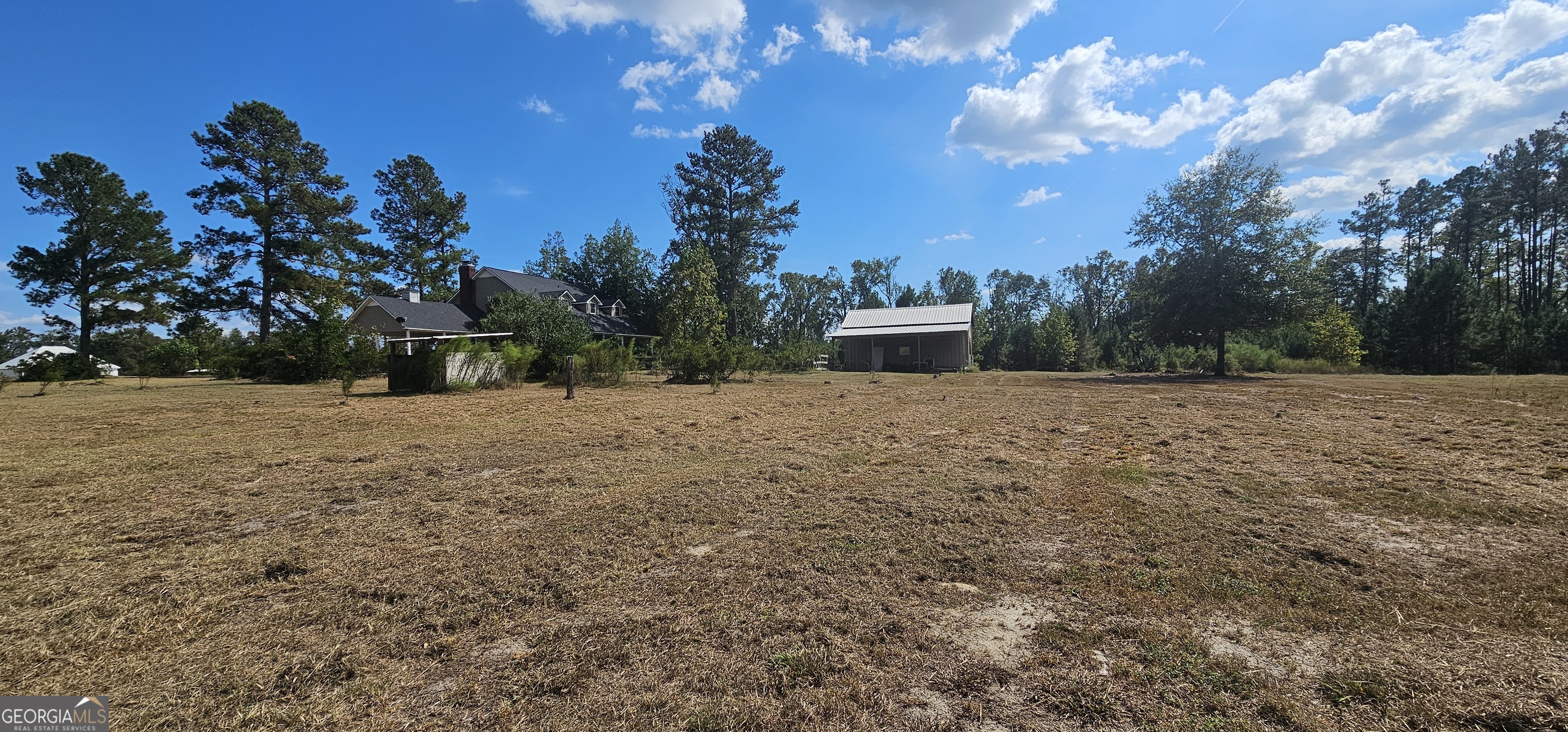 1717 Grady Saunders Road Portal, GA 30450 - Photo 39 of 41 a view of a white house with a yard