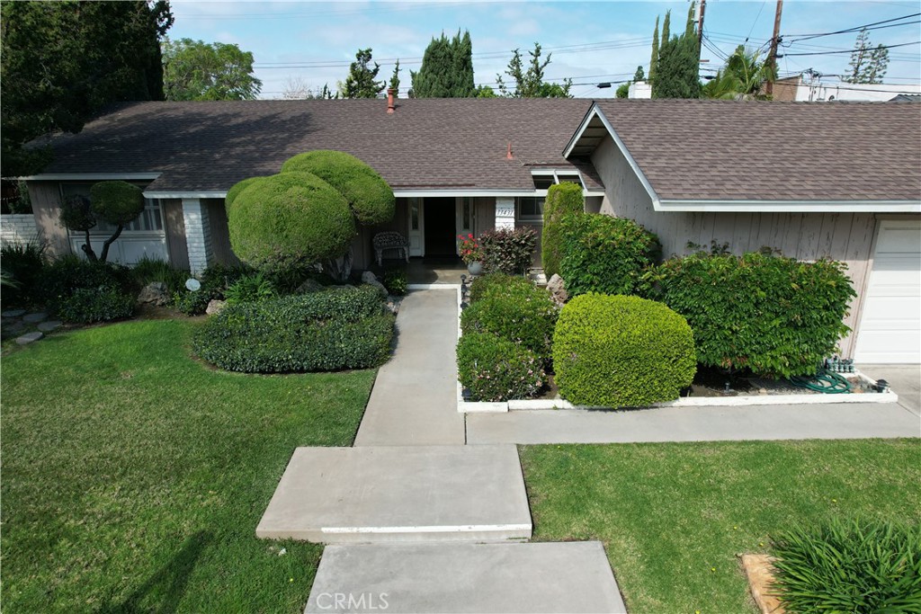 a aerial view of a house with garden and plants