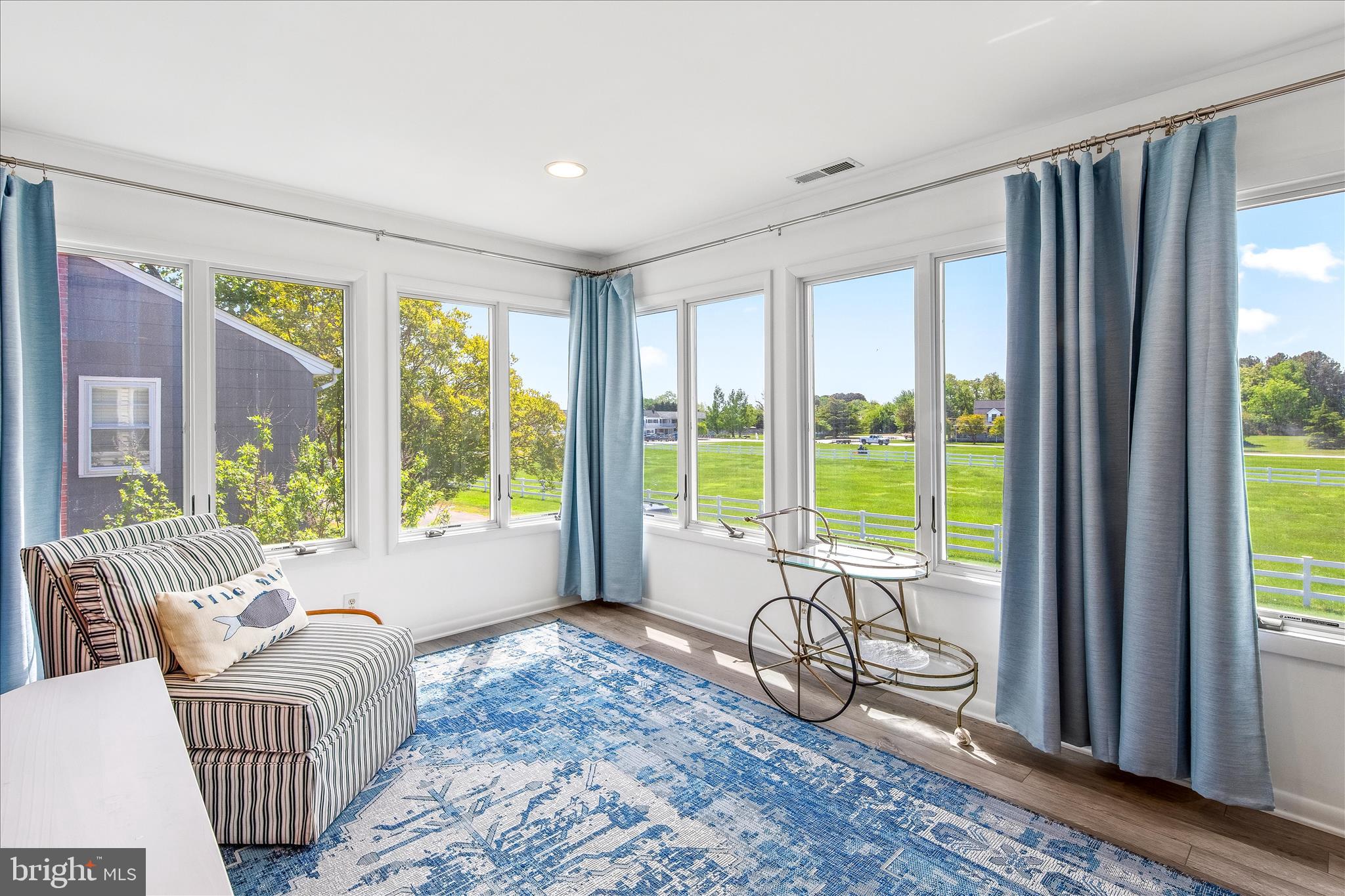 21406 Dogwood Cove Road Tilghman, MD 21671 - Photo 53 of 68 a living room with furniture and floor to ceiling windows