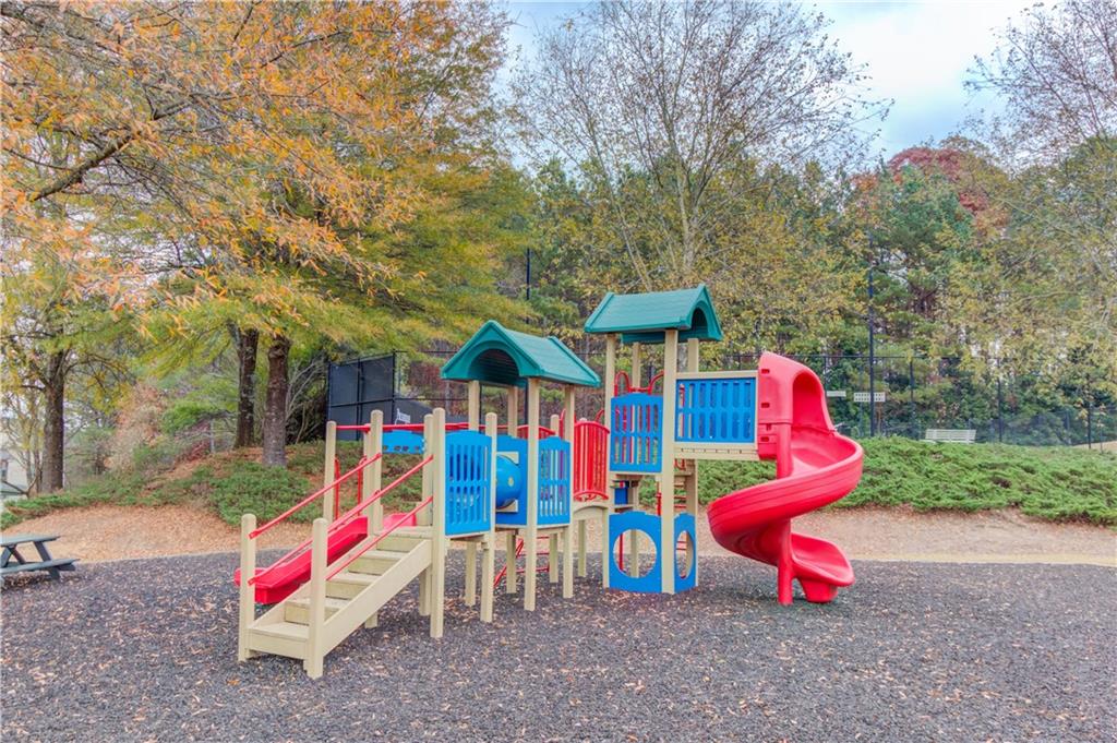 1810 Primrose Park Road Sugar Hill, GA 30518 - Photo 49 of 51 a view of outdoor space with playground and tree