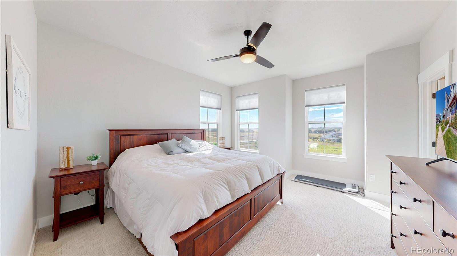 275 Dipper Court Berthoud, CO 80513 - Photo 12 of 34 a bedroom with a bed and a window
