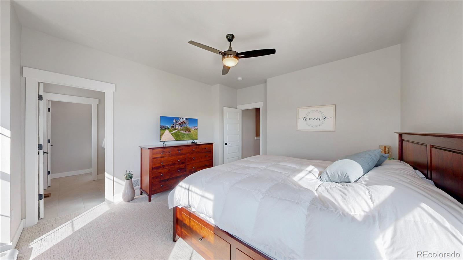275 Dipper Court Berthoud, CO 80513 - Photo 13 of 34 a bedroom with a bed and a dresser