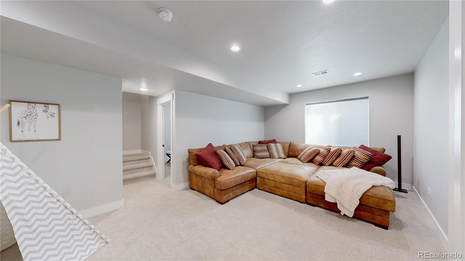 275 Dipper Court Berthoud, CO 80513 - Photo 25 of 34 a living room with furniture and a couch