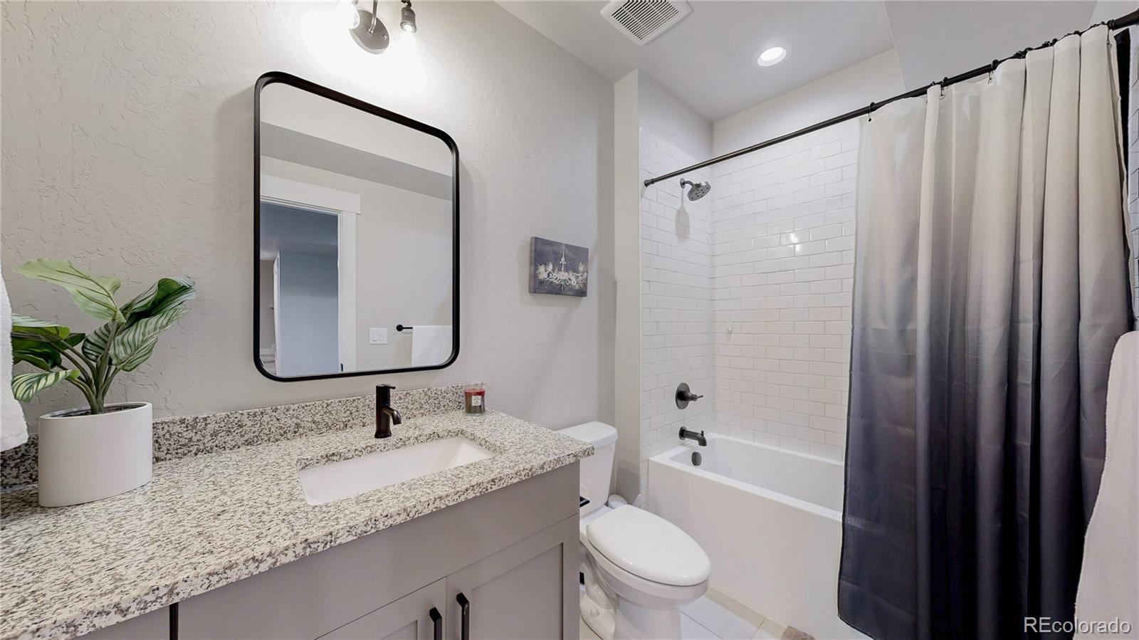 275 Dipper Court Berthoud, CO 80513 - Photo 28 of 34 a bathroom with a granite countertop sink toilet and shower