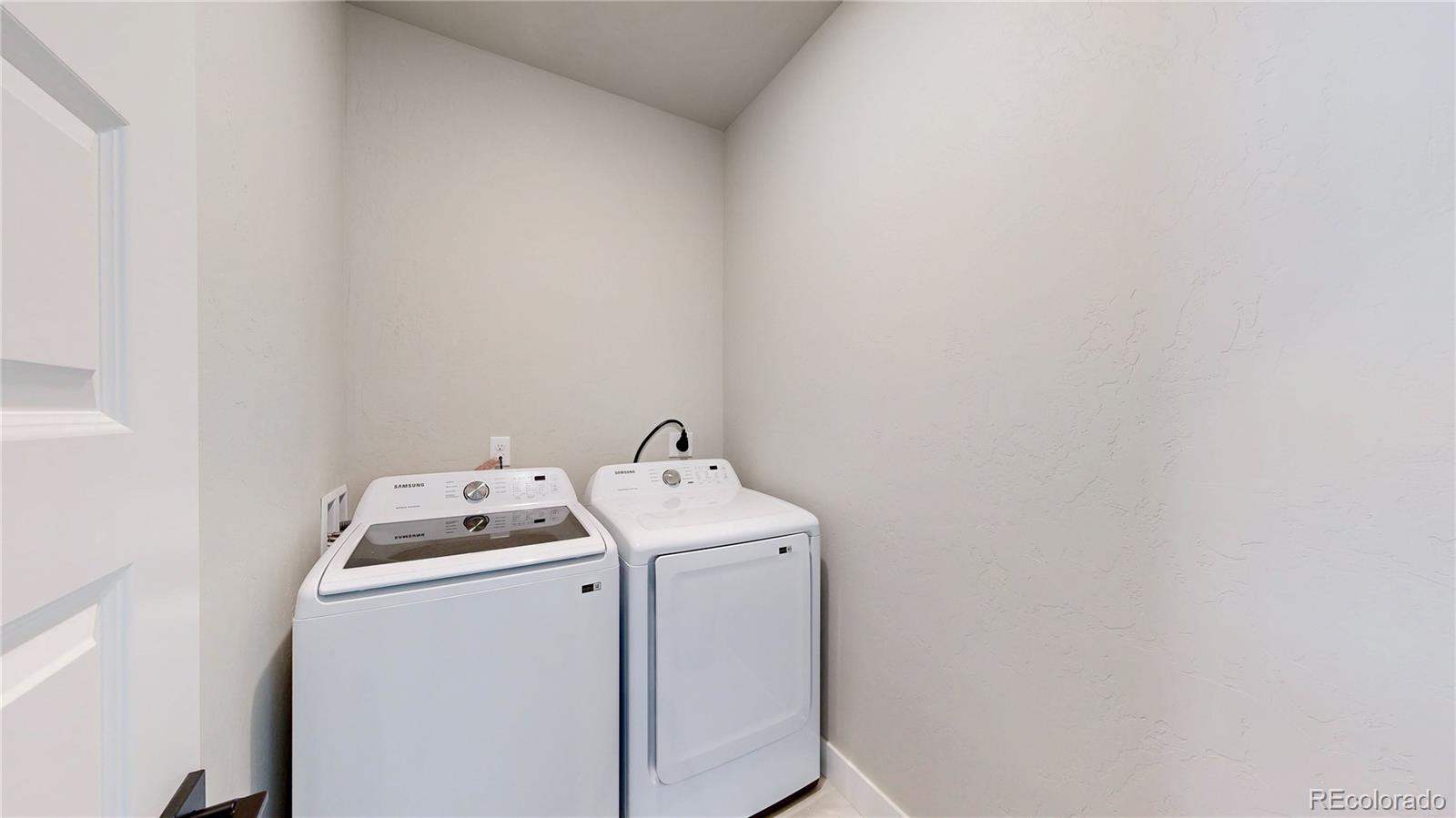 275 Dipper Court Berthoud, CO 80513 - Photo 29 of 34 a utility room with dryer and washer