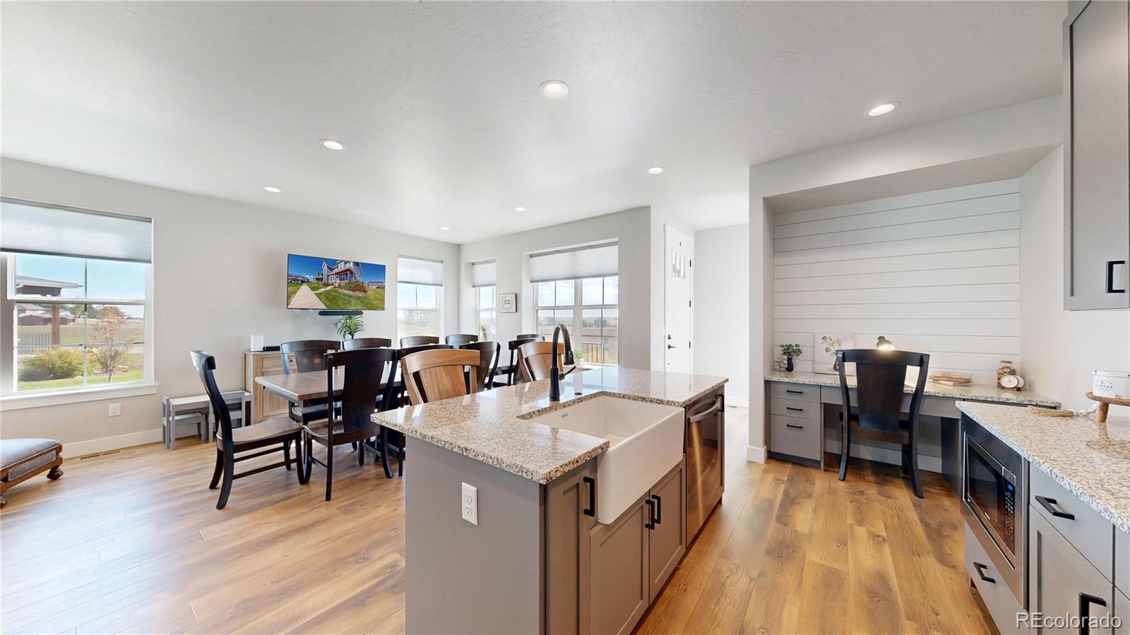 275 Dipper Court Berthoud, CO 80513 - Photo 6 of 34 a view of a dining room with furniture window and wooden floor