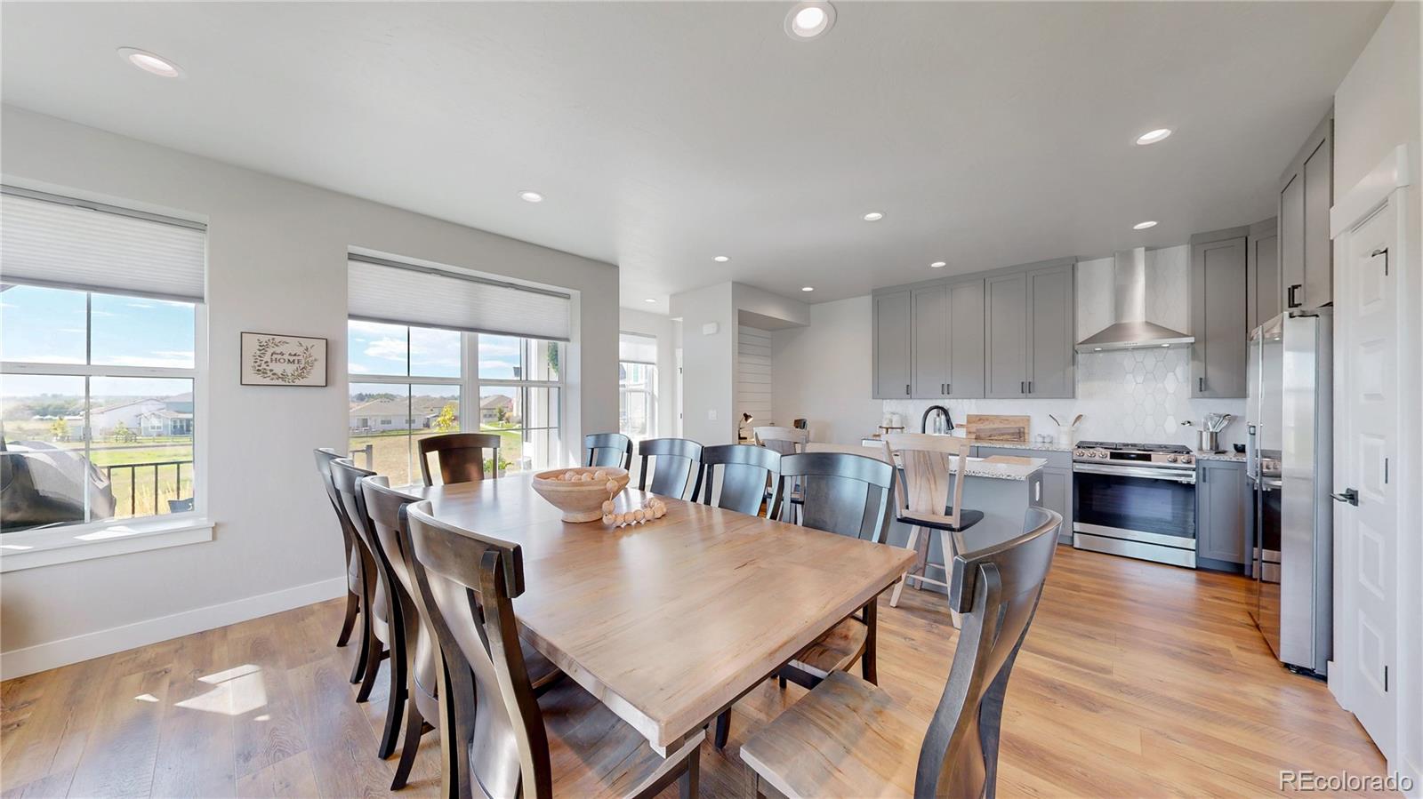 275 Dipper Court Berthoud, CO 80513 - Photo 8 of 34 a view of a dining room with furniture and wooden floor
