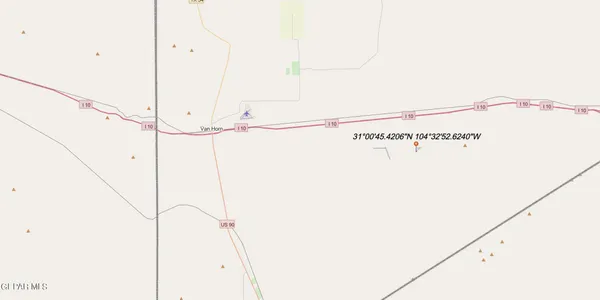 a view of a mountain range with trees in the background