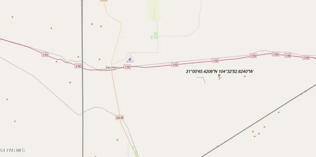 a view of a mountain range with trees in the background