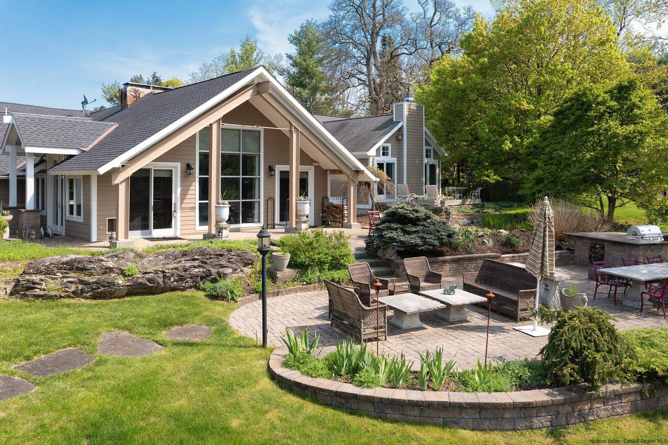 42 Union Center Road Ulster Park, NY 12487 - Photo 1 of 35 a view of a house with backyard sitting area and swimming pool