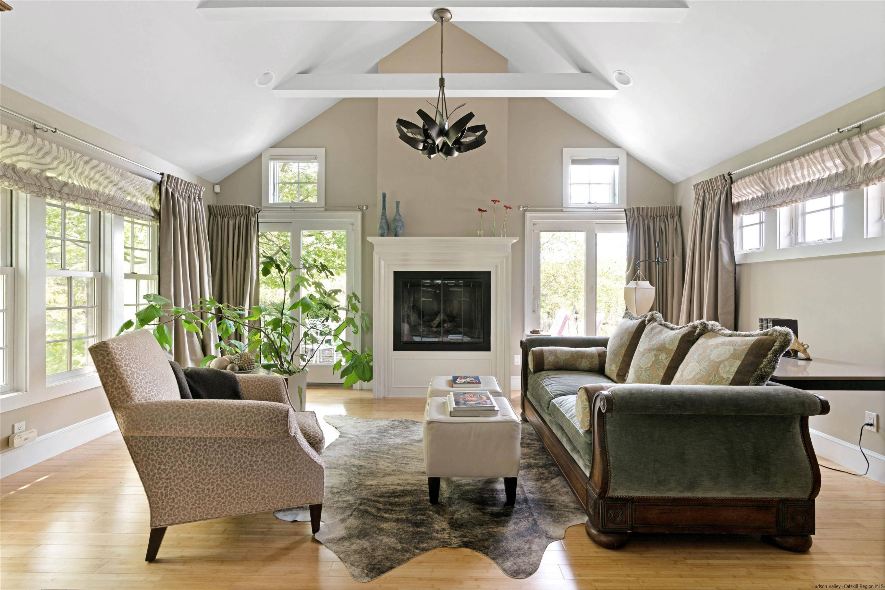 42 Union Center Road Ulster Park, NY 12487 - Photo 20 of 35 a living room with furniture a fireplace and a chandelier