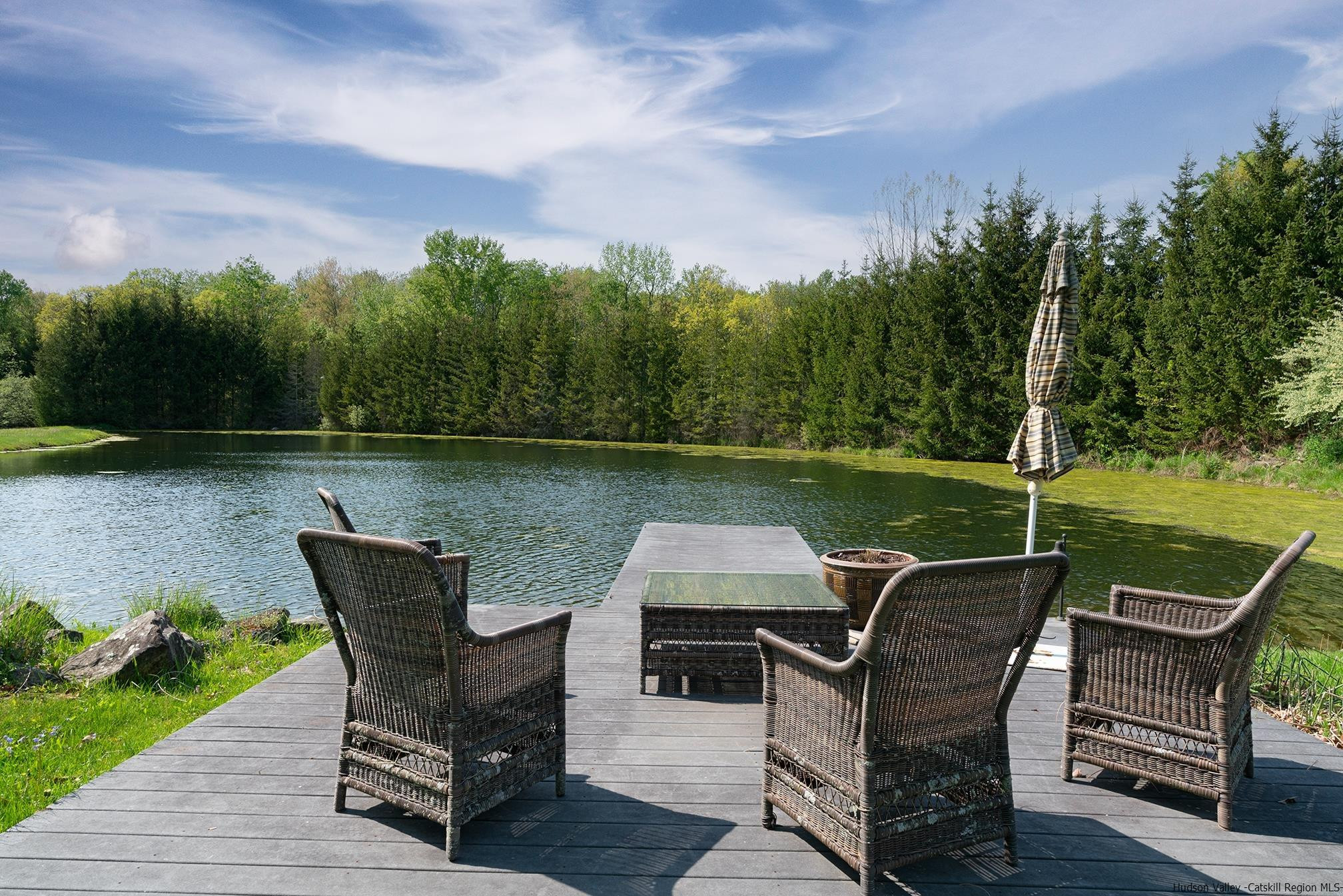 42 Union Center Road Ulster Park, NY 12487 - Photo 2 of 35 a view of a chairs and table on the wooden deck
