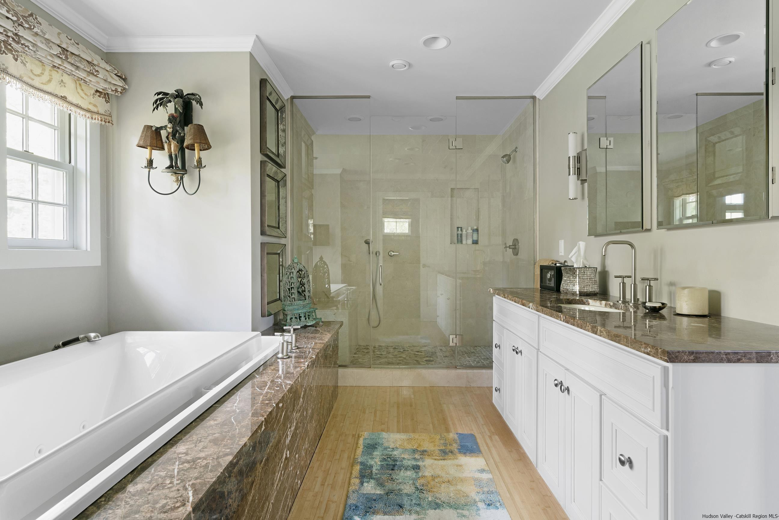 42 Union Center Road Ulster Park, NY 12487 - Photo 21 of 35 a spacious bathroom with a tub sink and mirror
