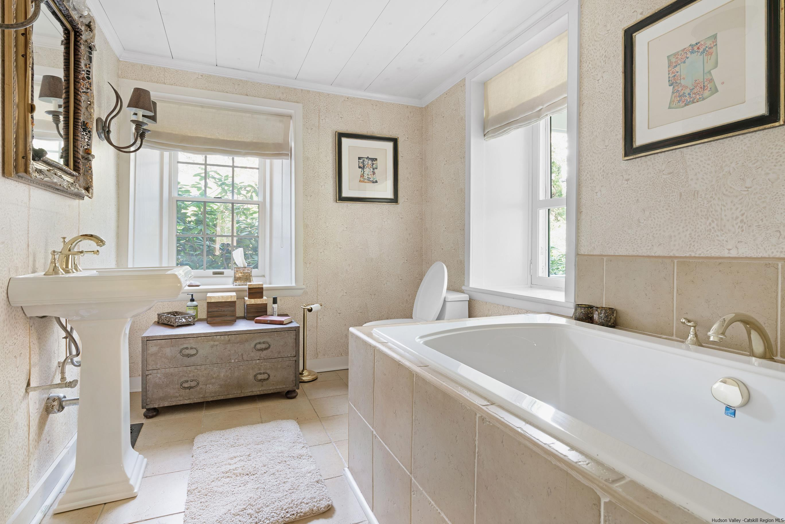 42 Union Center Road Ulster Park, NY 12487 - Photo 25 of 35 a bathroom with a tub sink double vanity and window