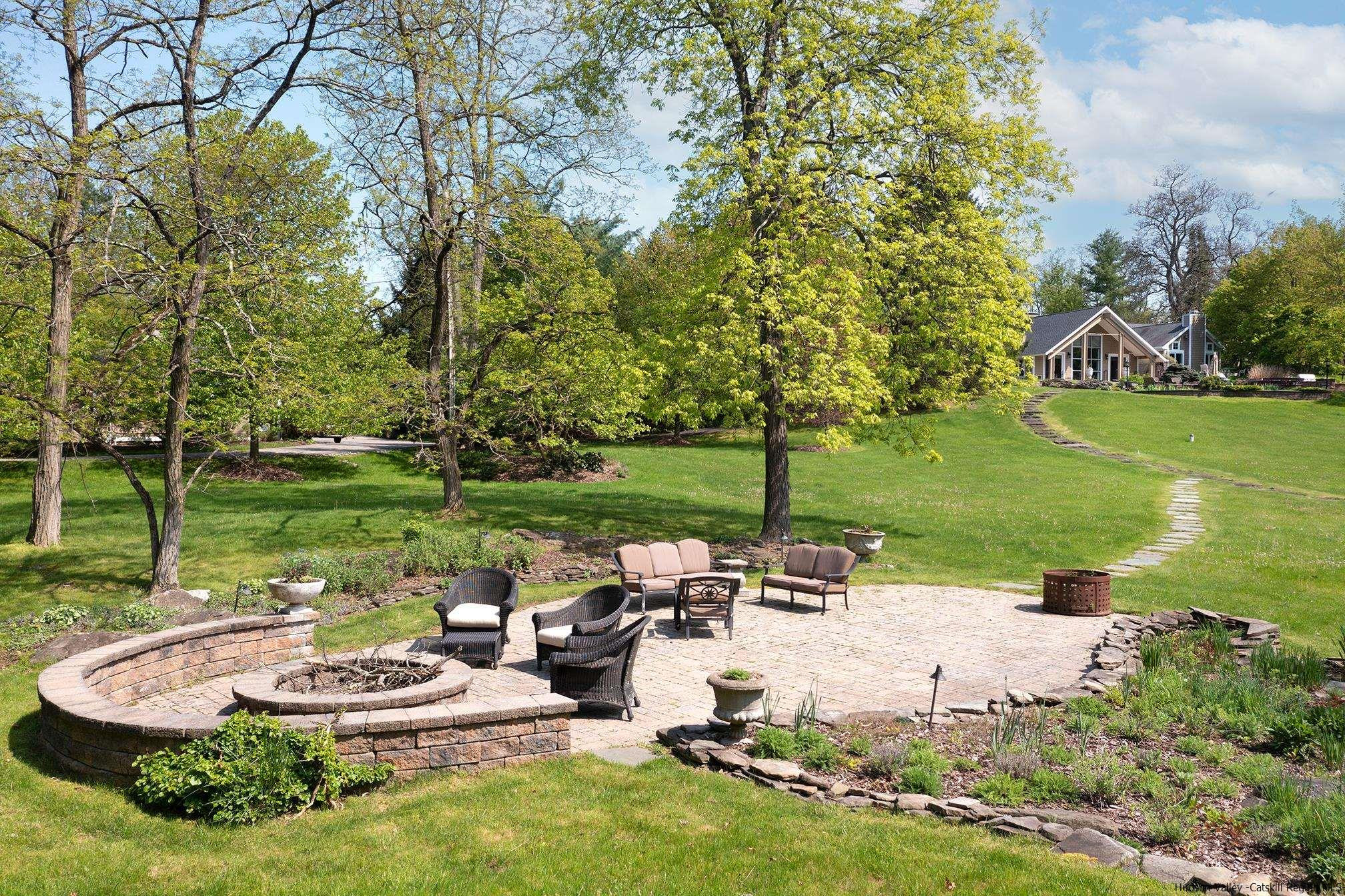 42 Union Center Road Ulster Park, NY 12487 - Photo 4 of 35 a view of a swimming pool and lounge chairs in back yard of the house