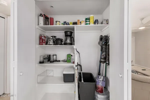 a kitchen with a refrigerator and cabinets